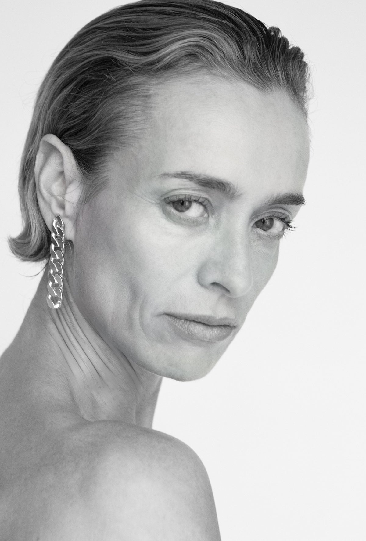 chain drop earrings worn modern sculptural look