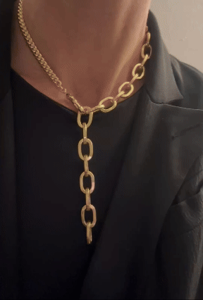 triple gold chain necklace worn sculptural statement look